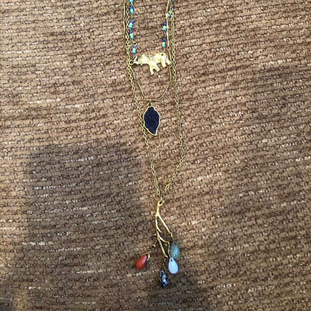 Triple stranded necklace with pendants